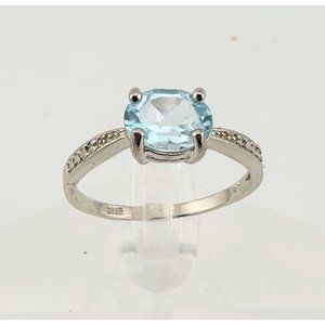 Shimmering Blue Topaz, Oval Cut with Diamond Accent Ring in Sterling Silver - Be